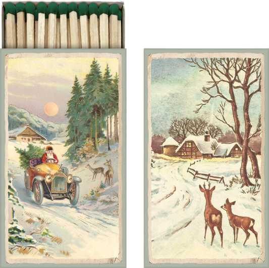 lange streichhölzer in einer vintage pappschachtel die beidseitig bedruckt ist mit einem weihnachtsmann im auto und rehen im schnee